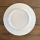 White and gold porcelain dinner plates