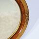 Miroir ovale en bois doré – début XXe