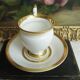 Tasse et soucoupe ancienne en porcelaine blanche et or XIXème avec poignée forme tête de cygne