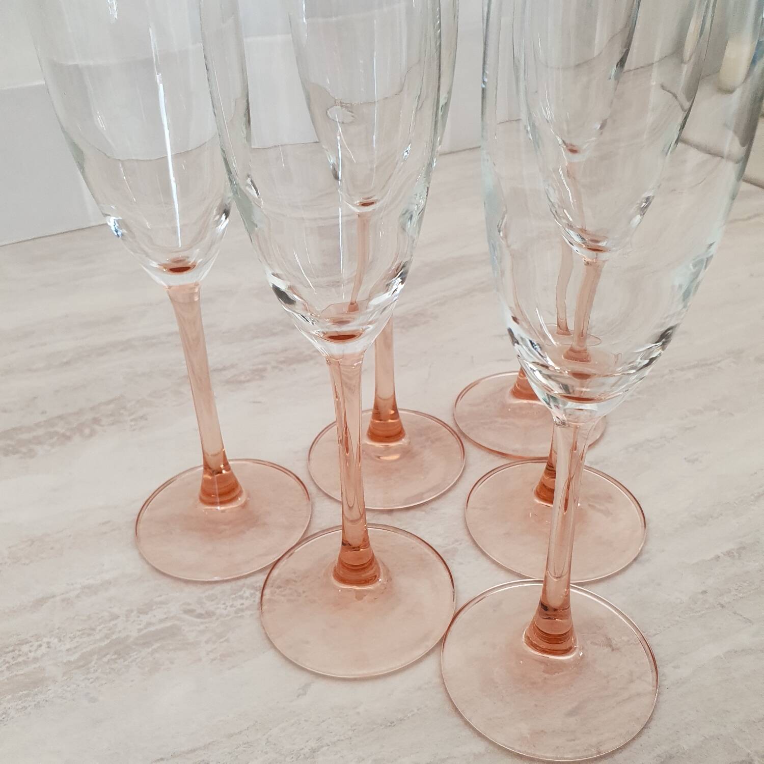 6 champagne flutes with pink stems