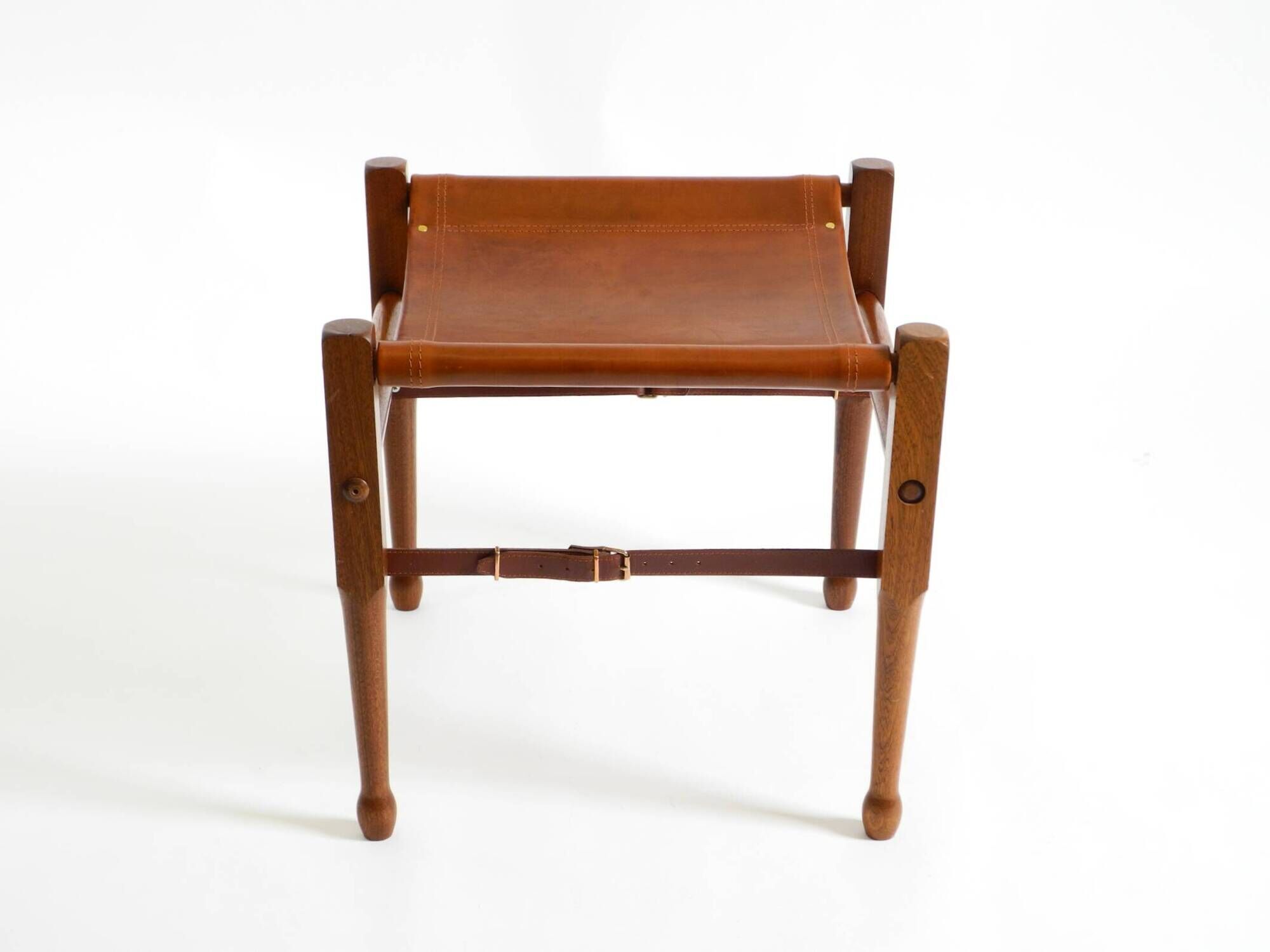 Rare 1990s safari stool with a teak frame and a seat made of brown saddle l