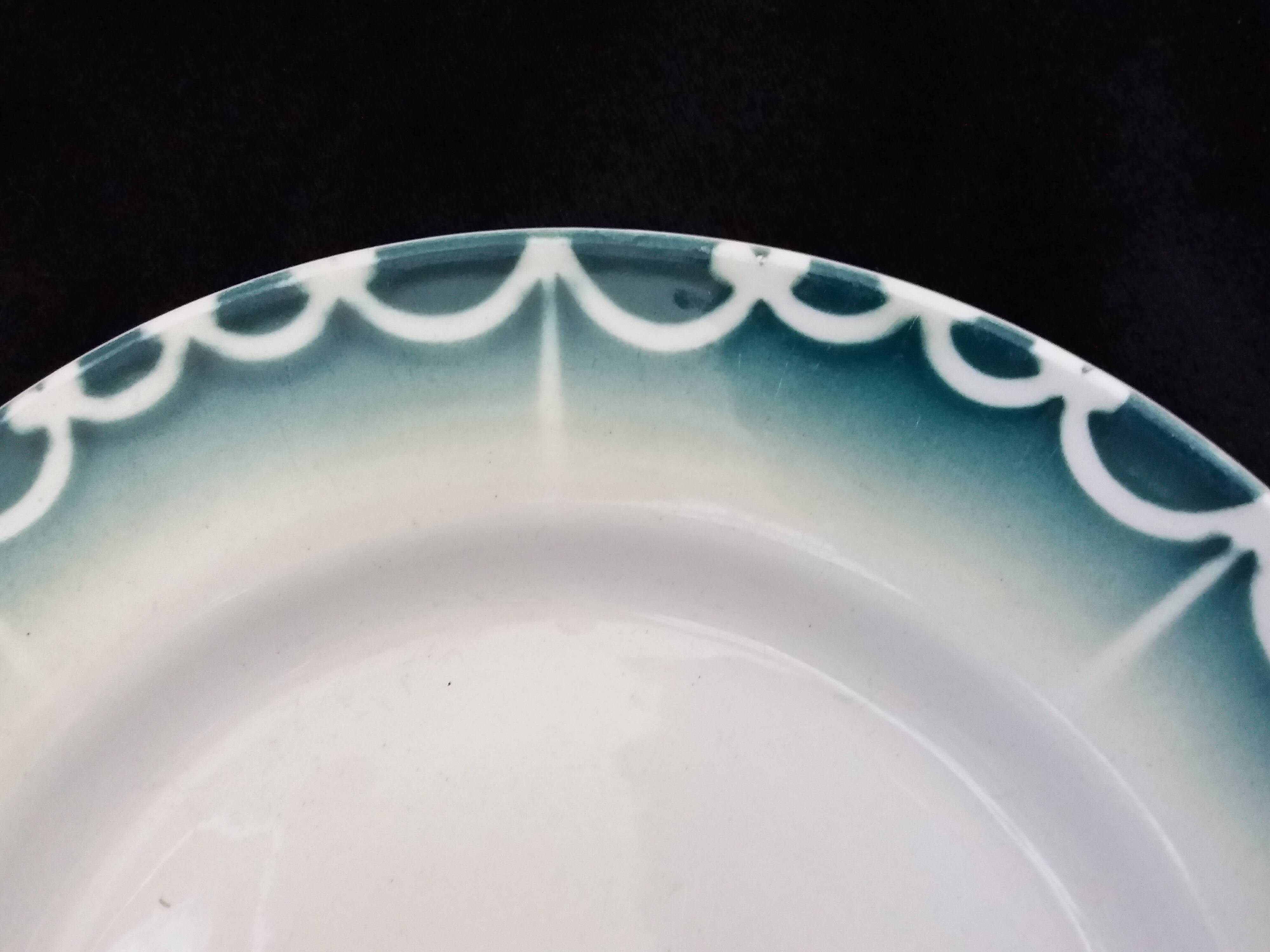 Old green and blue mismatched plates from Digoin, Salins, Moulin des Loups