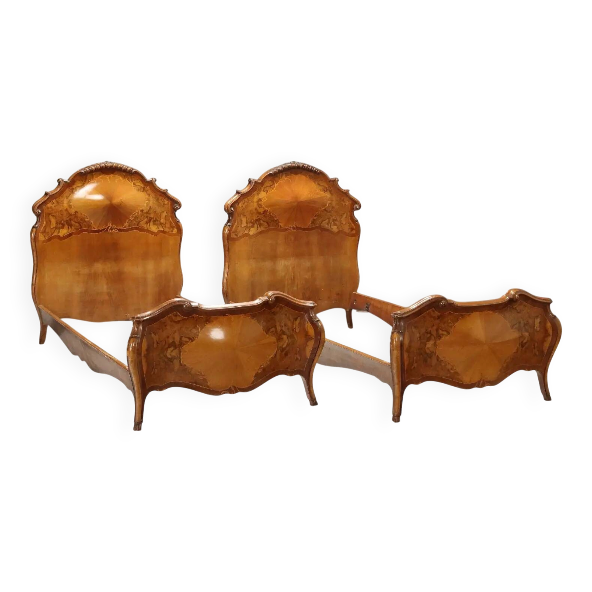 Simple old baroque-style beds in various woods from the 20th century.
