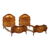 Simple old baroque-style beds in various woods from the 20th century.