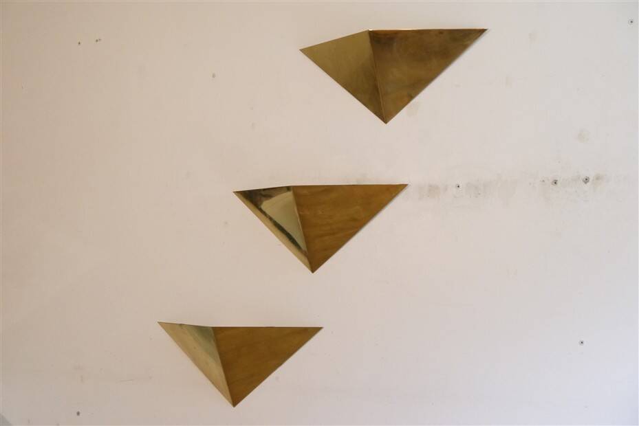 Minimalist brass wall lights