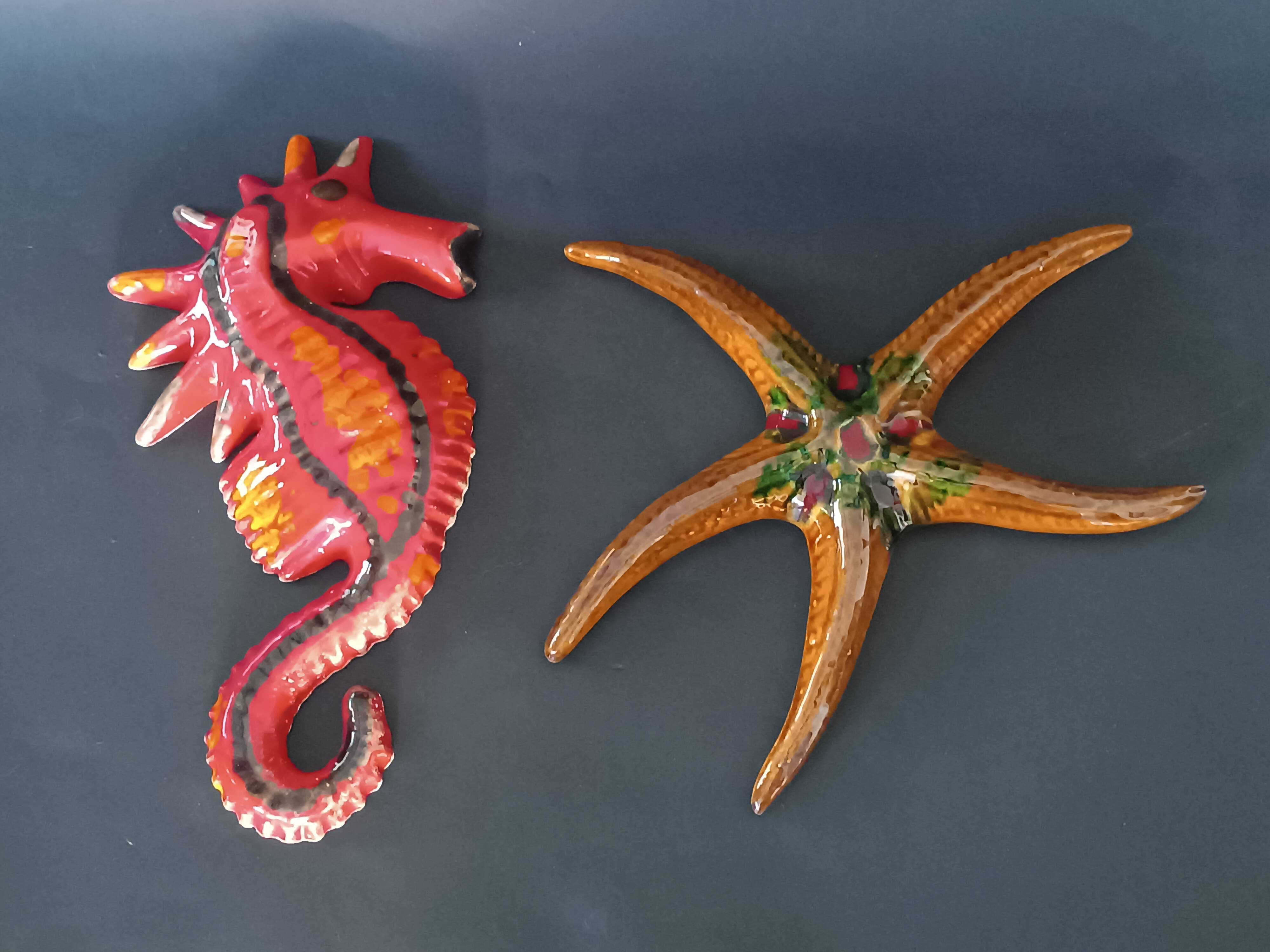 Two vintage ceramic wall pots featuring a seahorse and a starfish.