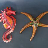 Two vintage ceramic wall pots featuring a seahorse and a starfish.