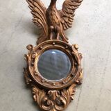 Miroir en bois doré Empire à décor d’aigle 40x97cm