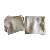Tablecloth and 8 damask linen napkins embroidered RT circa 1900.