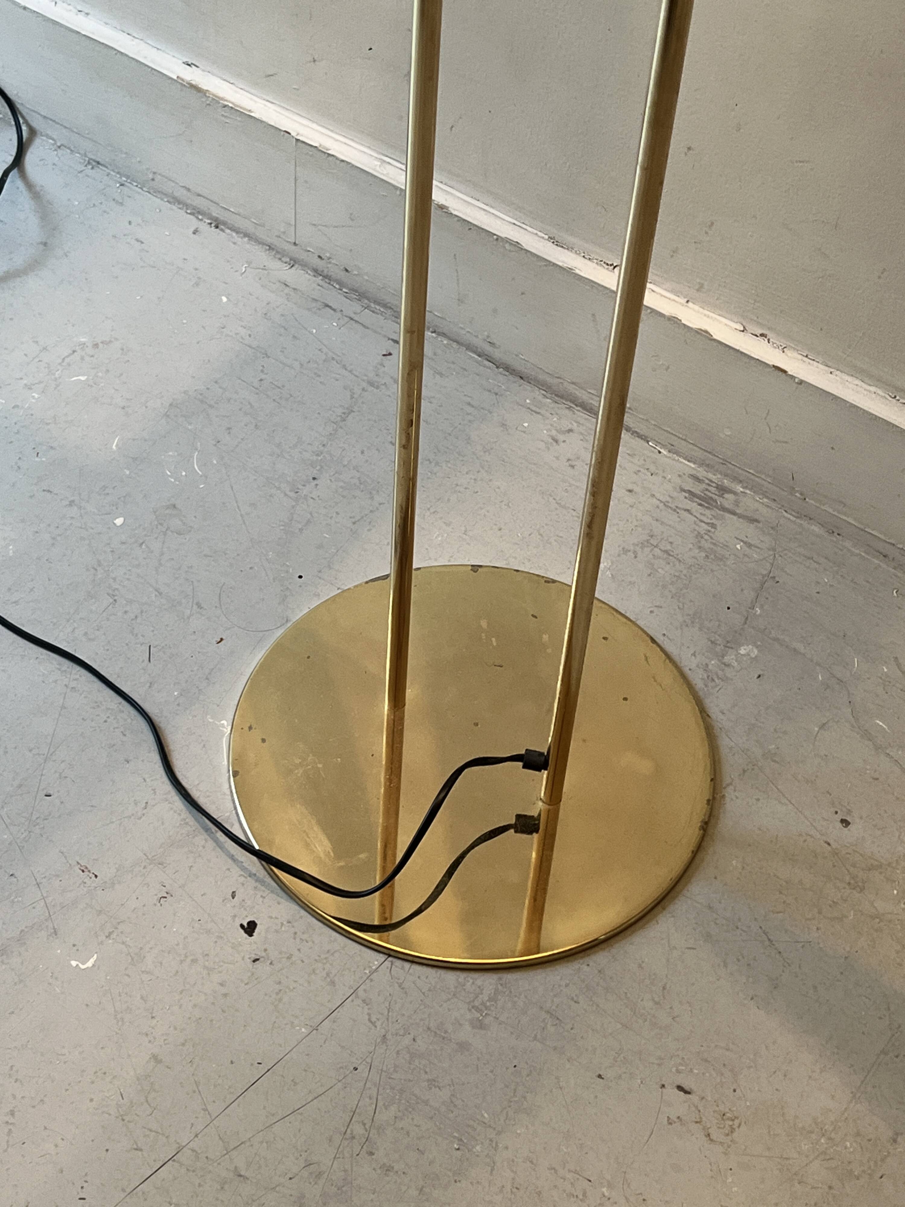 Modernist halogen floor lamp with a gold bowl, 1980.