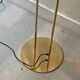 Modernist halogen floor lamp with a gold bowl, 1980.