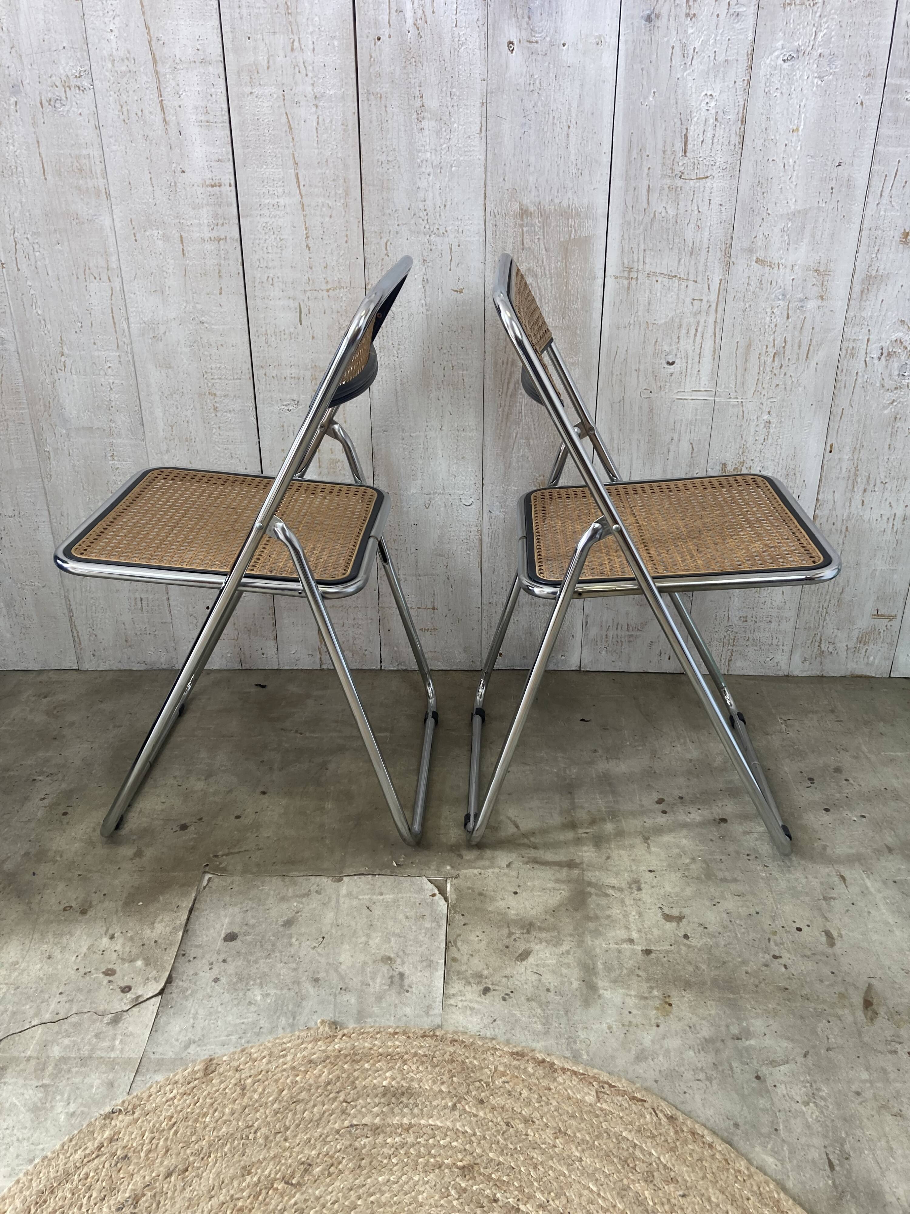 Pair of chrome and cane folding chairs