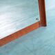 Minimalist Scandinavian mirror in teak with a vintage design.