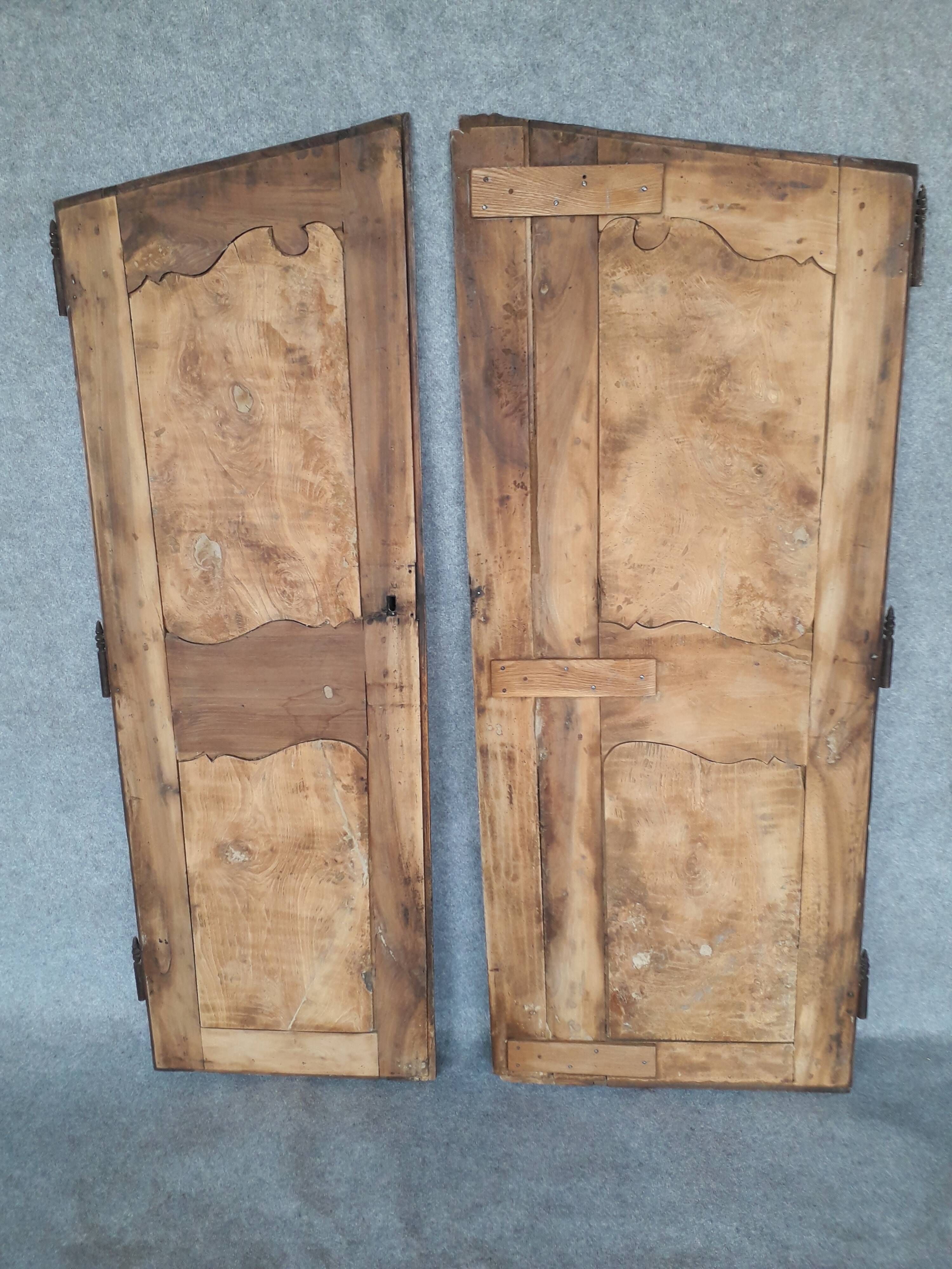 Pair of Louis XV period walnut and ash cabinet doors