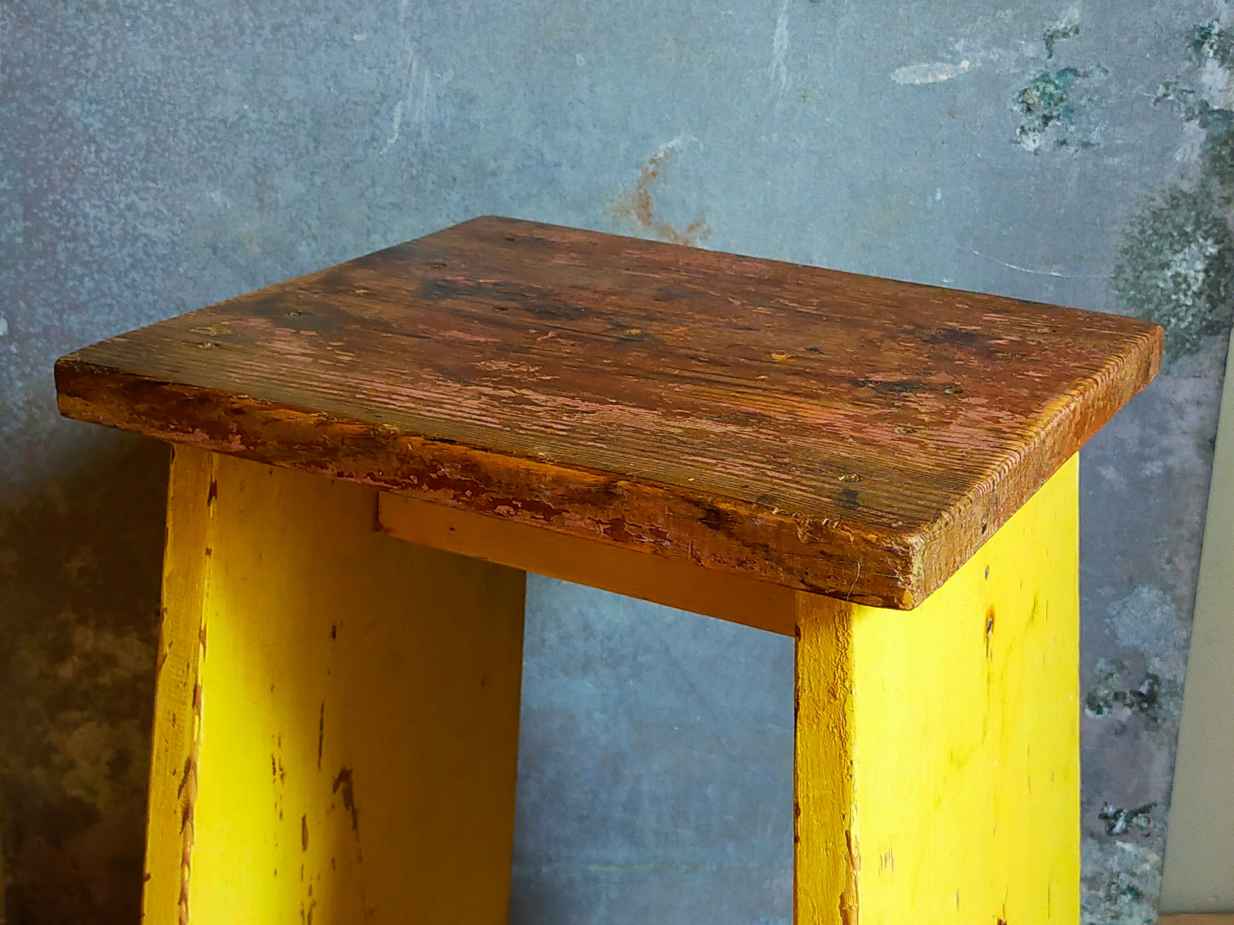 Art-populaire workshop stool in patinated wood