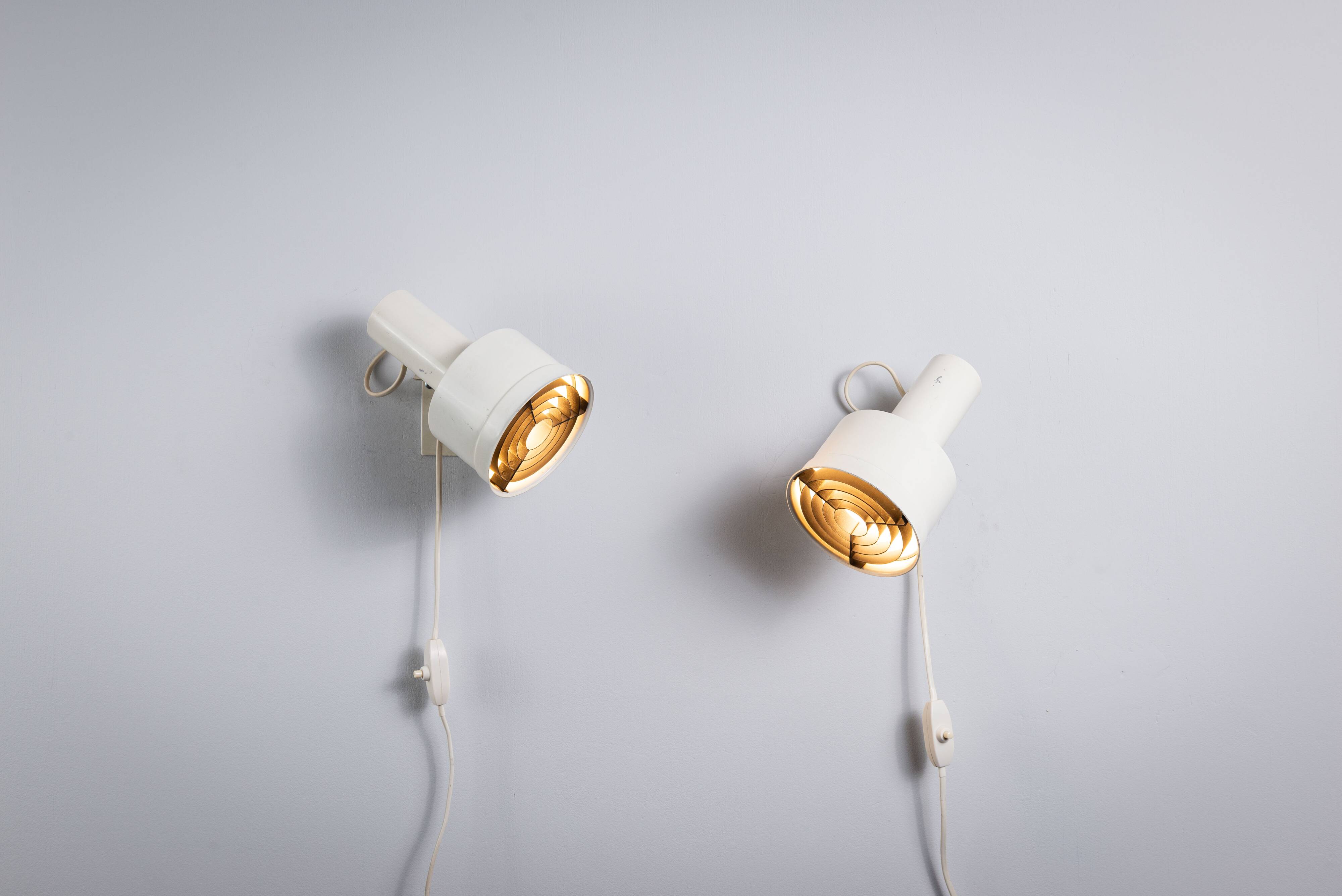 Pair of adjustable wall lamps designed by Per Sundstedt for Kosta Lampan