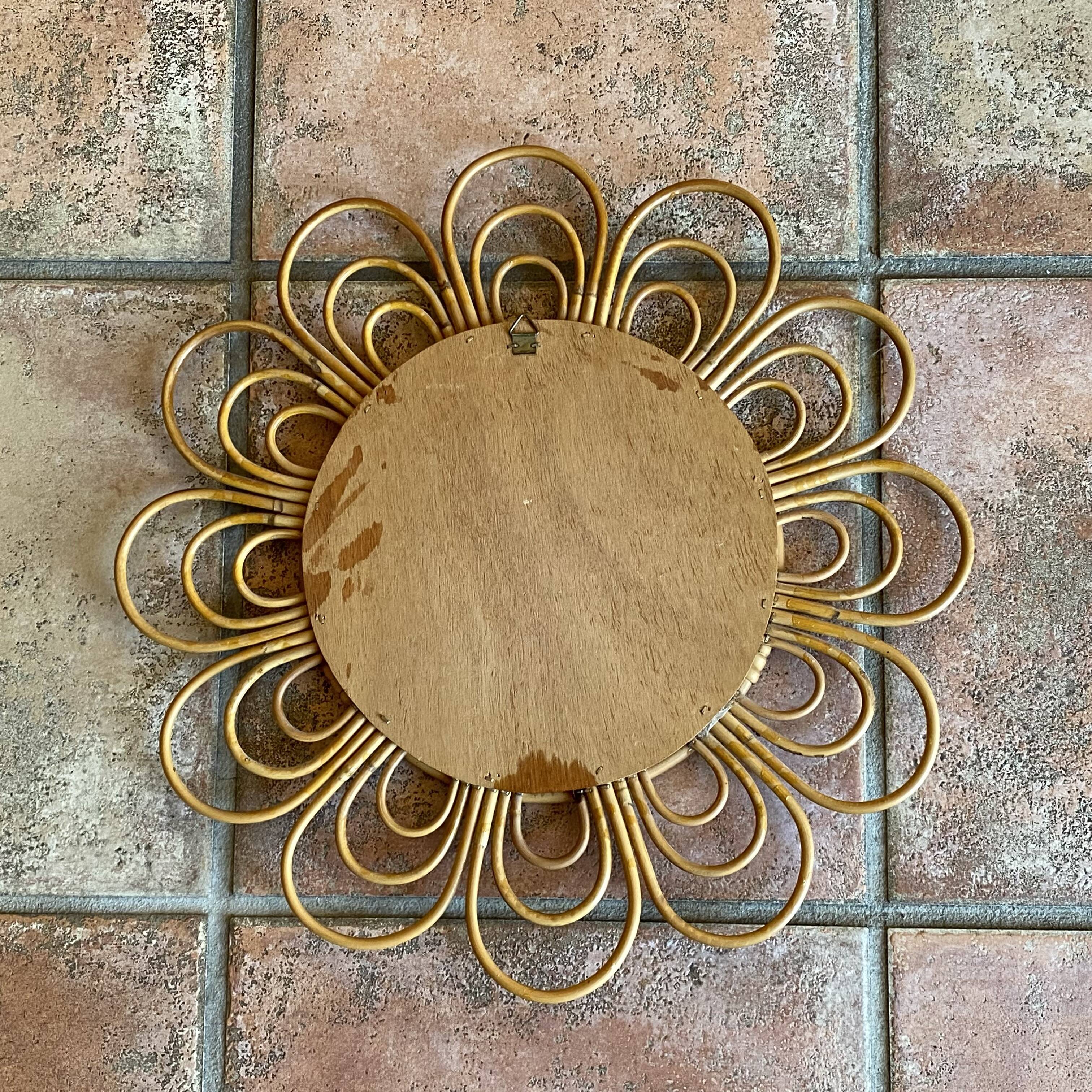 Sun mirror in arched rattan. 40cm. 1960.