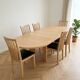 Skovby dining table and 8 vintage Scandinavian style wooden chairs.