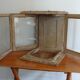 Vitrine XVIIIeme siecle a trois vantaux mobiles
