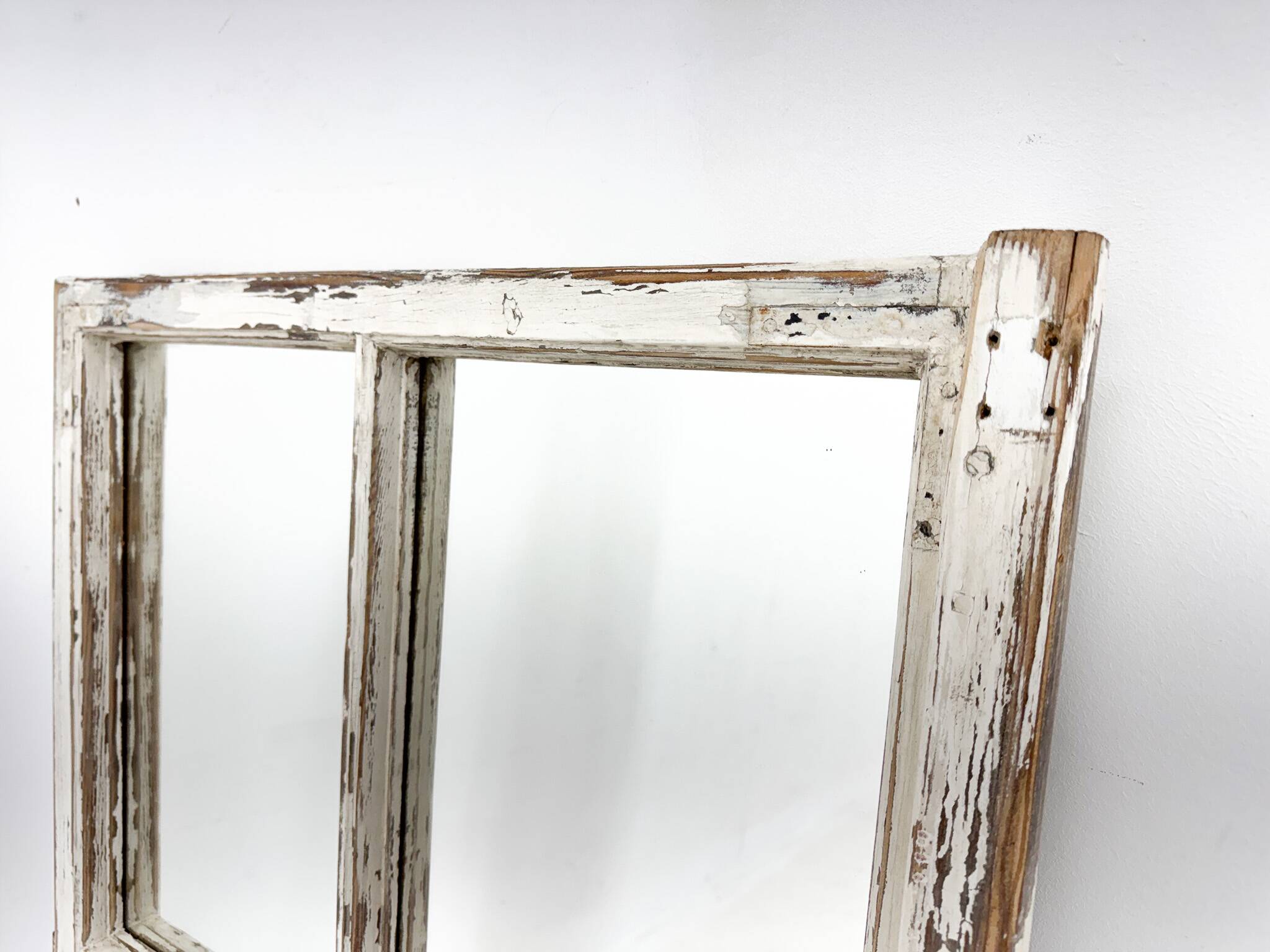 Vintage wooden window converted to a mirror