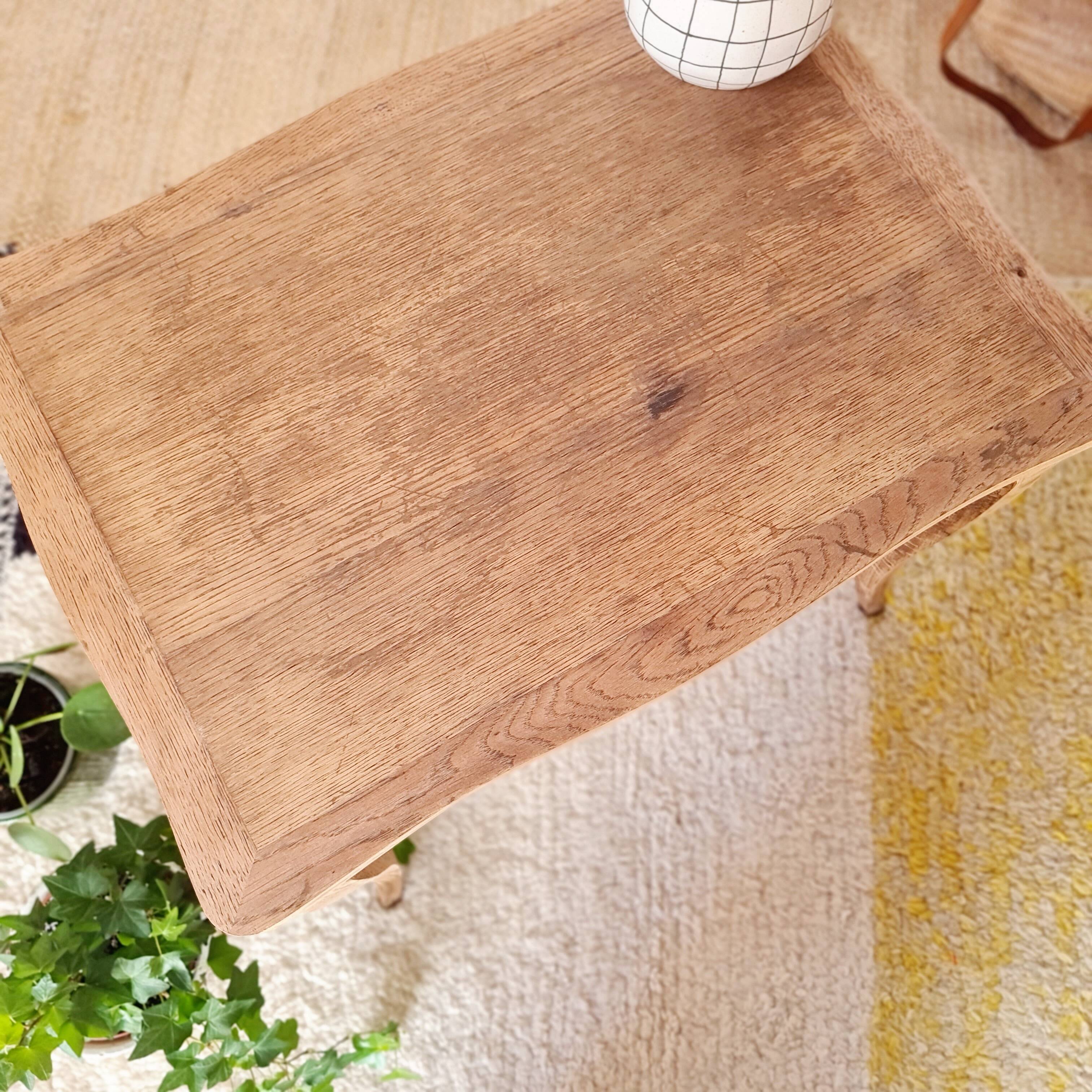 Antique coffee table with curved legs.