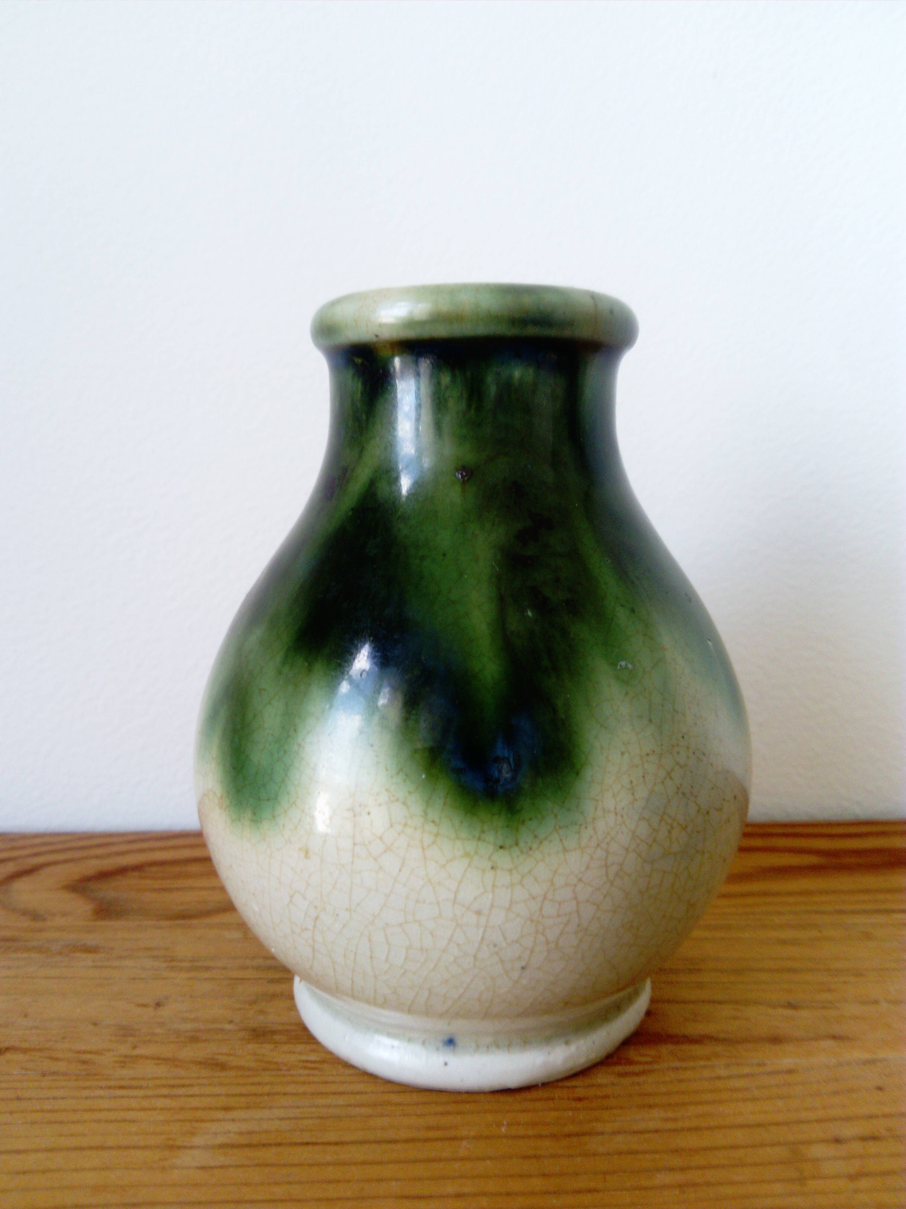 small green and cream glazed ceramic vase