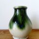 small green and cream glazed ceramic vase