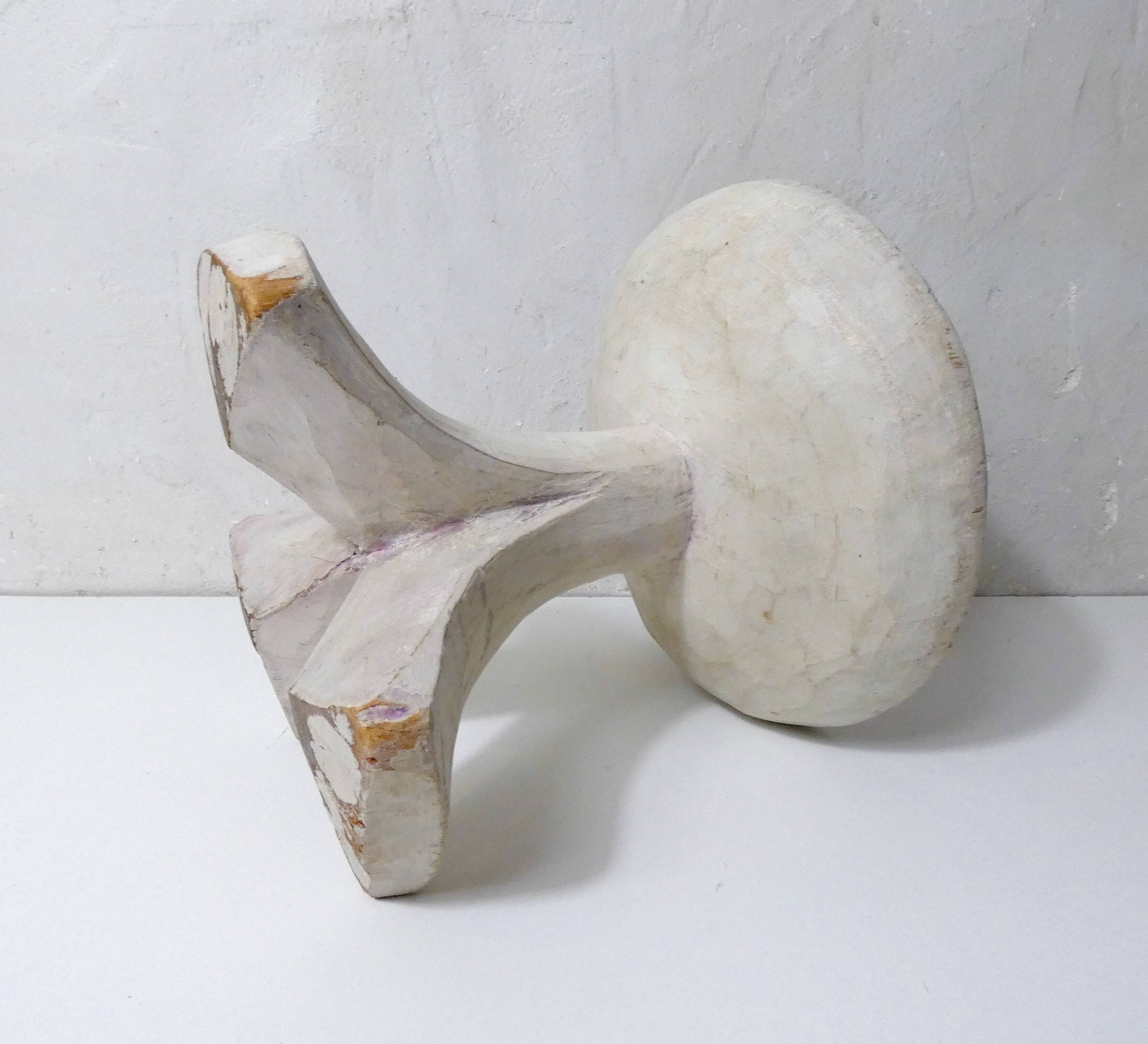 antique small tripod bench/stool in solid carved brutalist wood