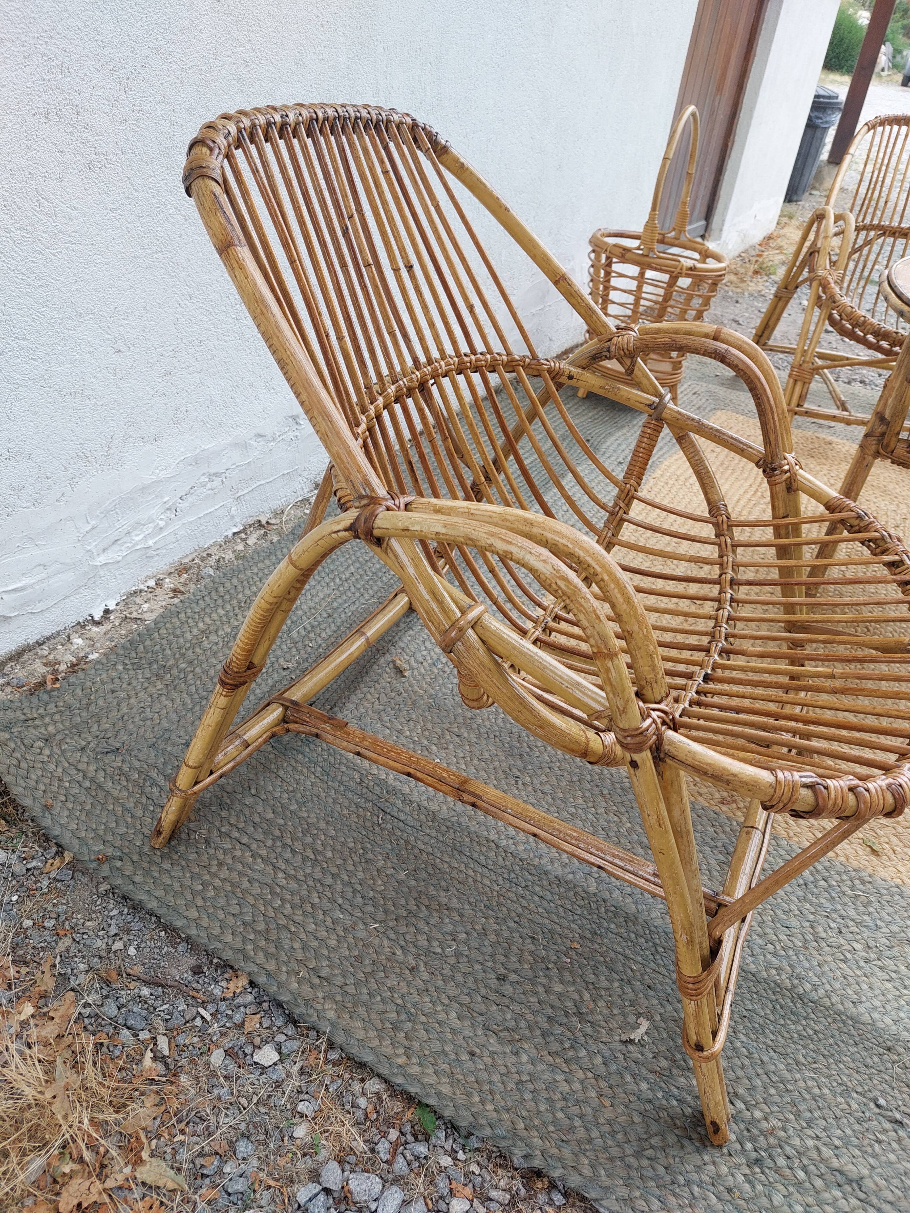 4 armchairs and a coffee table made of rattan and bamboo wood, vintage.