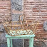 Rattan bassinet with hood arches