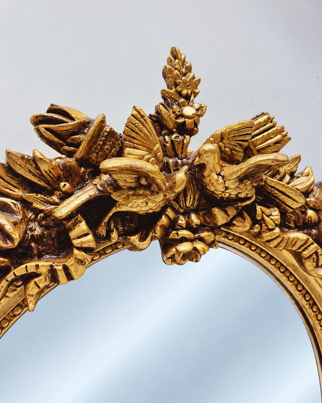 Large gold full-length mirror with ornate crest