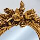 Large gold full-length mirror with ornate crest