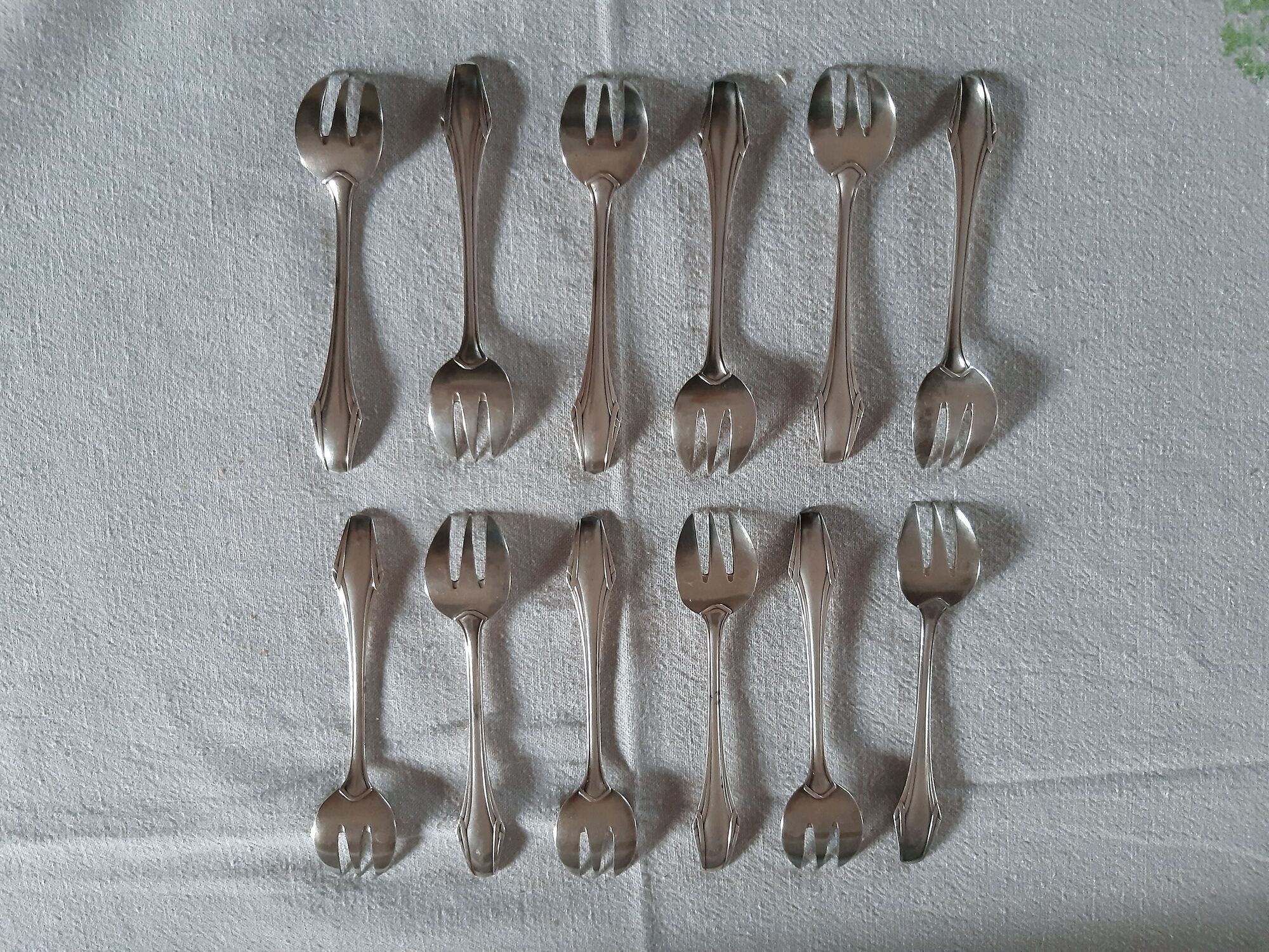 12 fourchettes à huitres métal argenté  art deco ravinet d'enfert