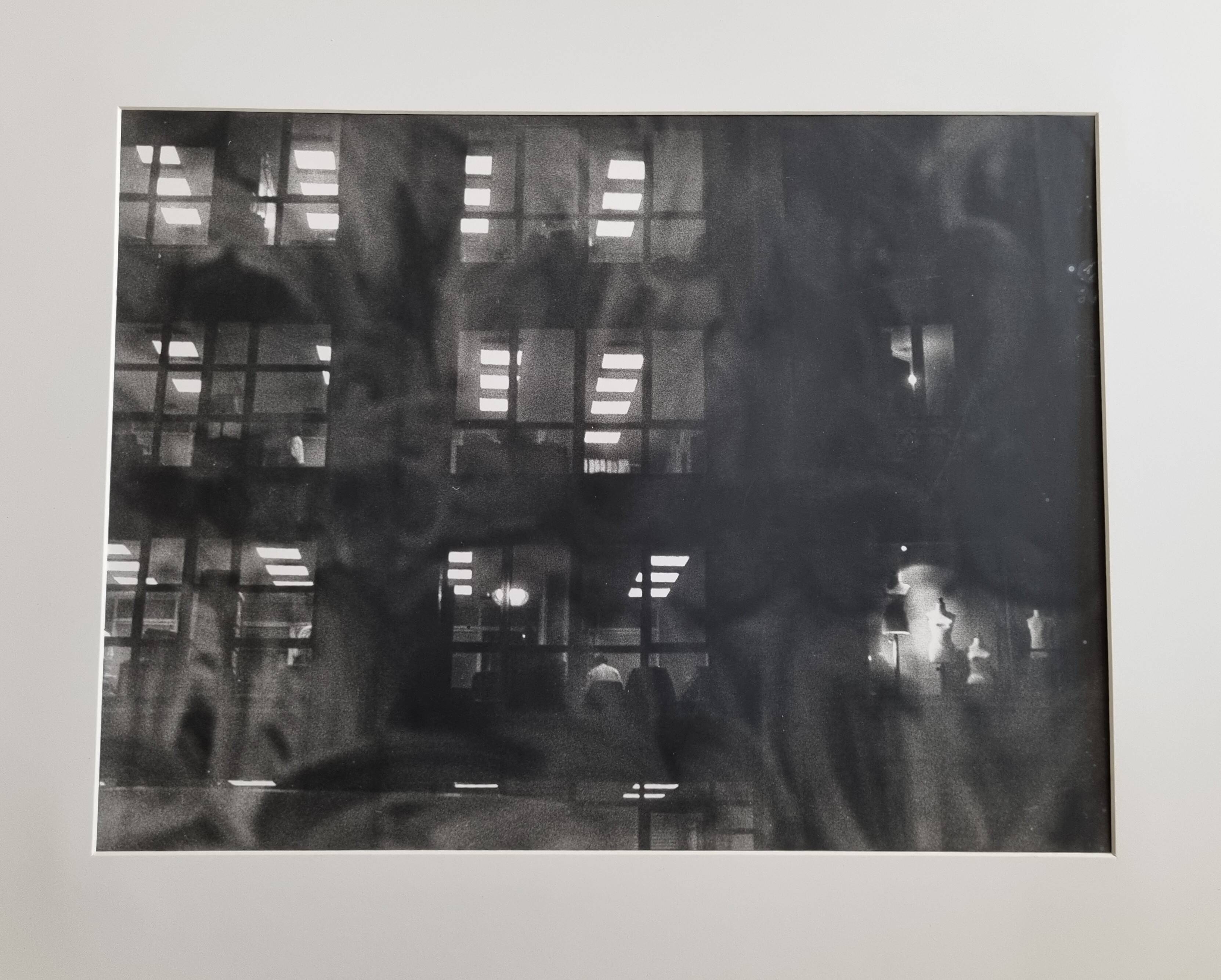 Framed black and white photograph of an urban scene by Rosine Nucimovici, 52x42 cm.