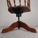 Oak office chair with a spring system and height adjustable, 1930s.