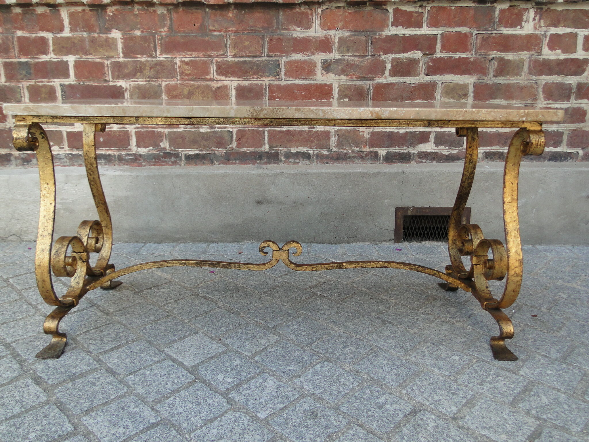Travertine coffee table, golden foot