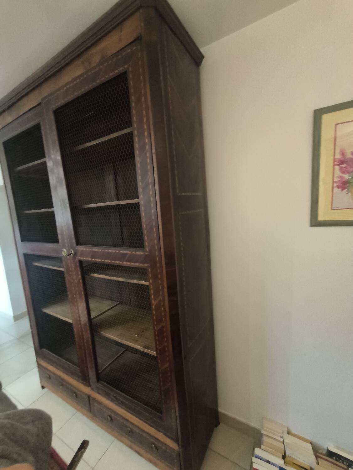 Library in marquetry with a grille from the Louis XVI period.