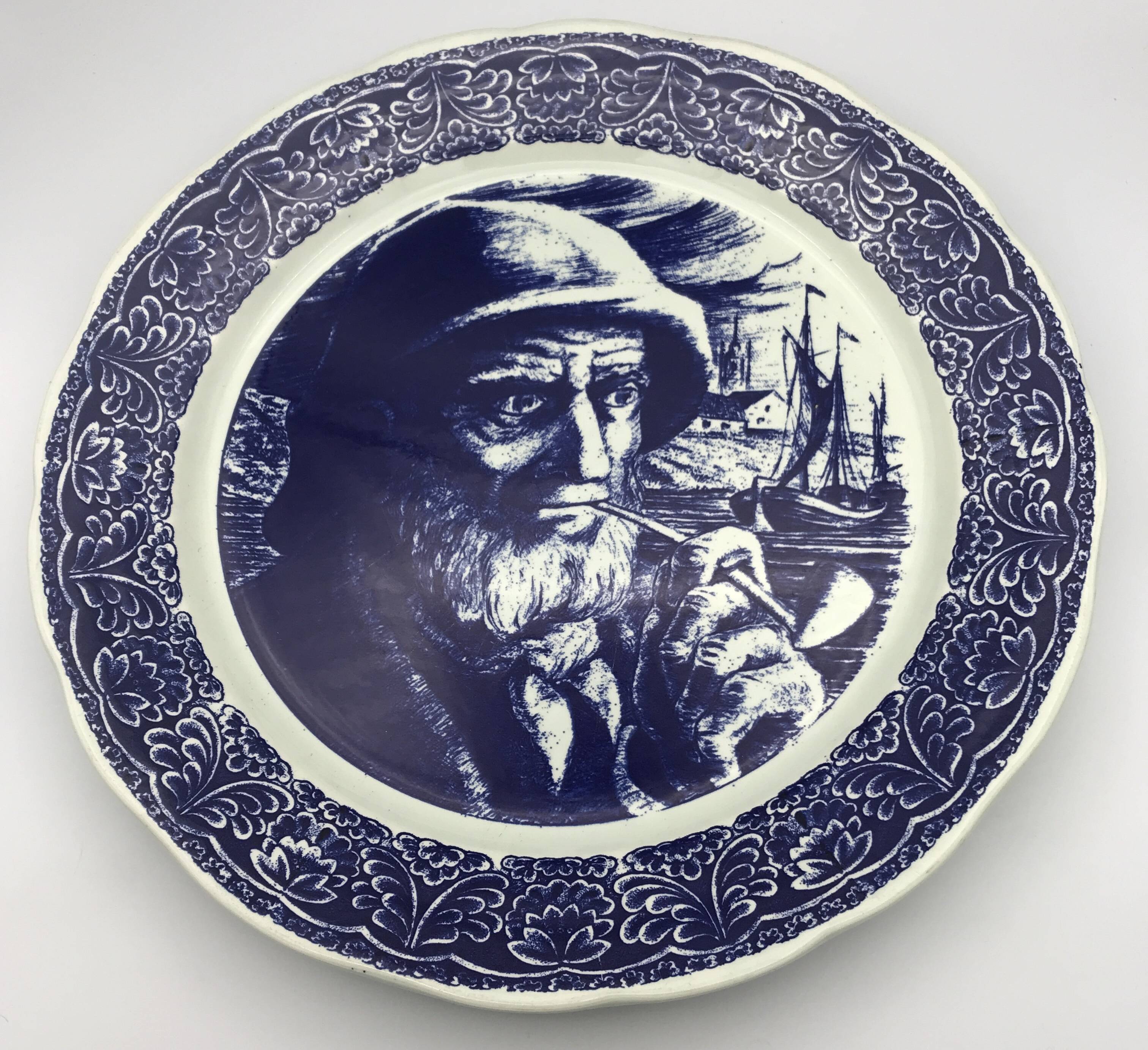 Blue enamelled earthenware wall plate with fisherman decor, Boch La Louvière, Belgium