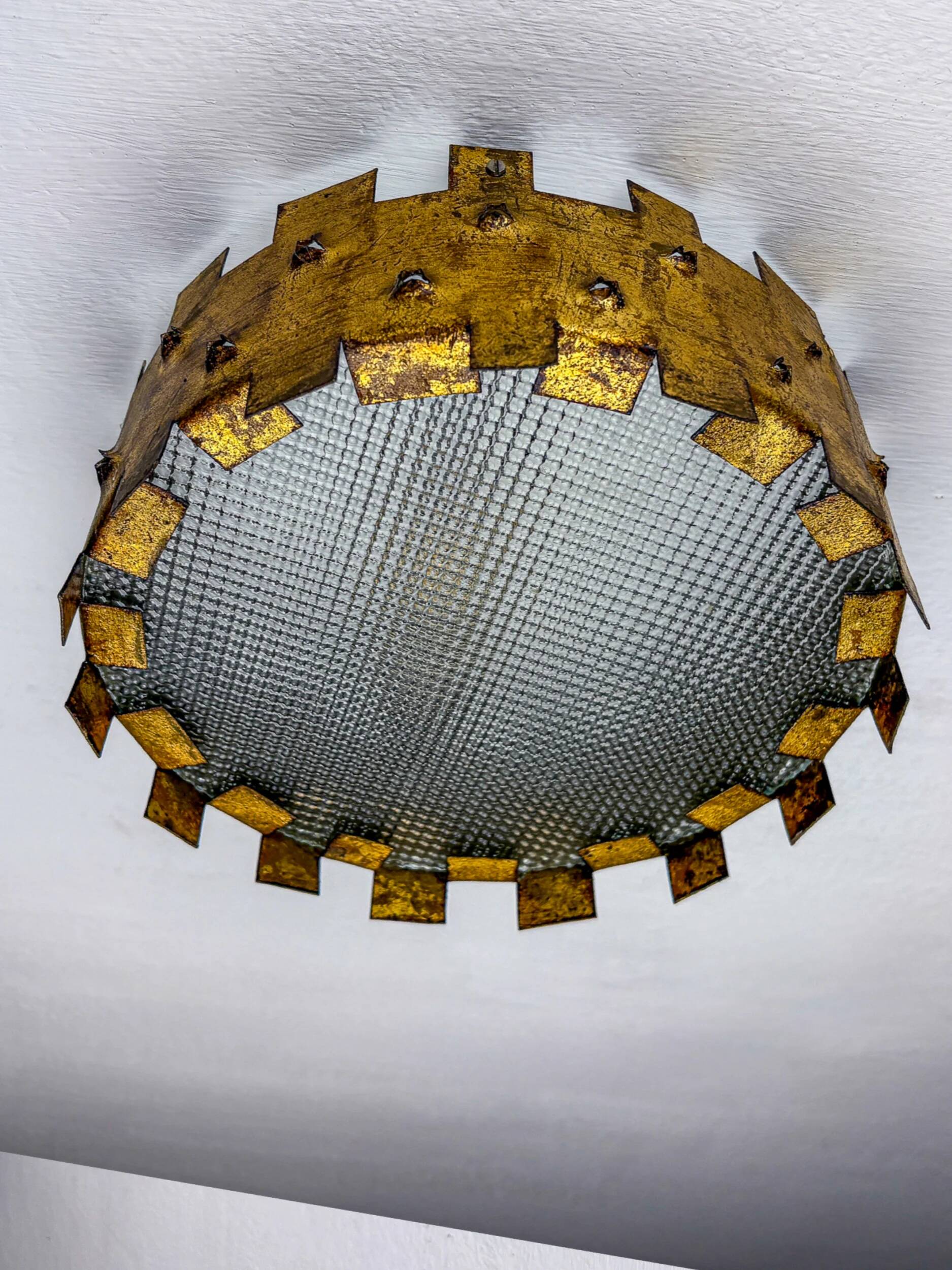 Brutalist crown sunburst fixture in gilt metal and frosted glass, France, 1960s