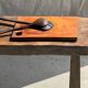 Small rectangular teak monoxyle cutting board with a circular handle.