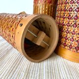 Old insulated bottles in woven bamboo