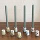 Set of 9 mini vintage porcelain candle holders decorated with spring flowers.