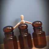 Trio round brown apothecary bottles