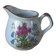 Vintage handmade speckled stoneware milk jug with floral design from the 1980s.