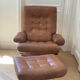 Armchair and footrest in leather