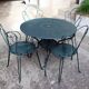 Old wrought iron garden furniture, 2 armchairs, 2 chairs and the table