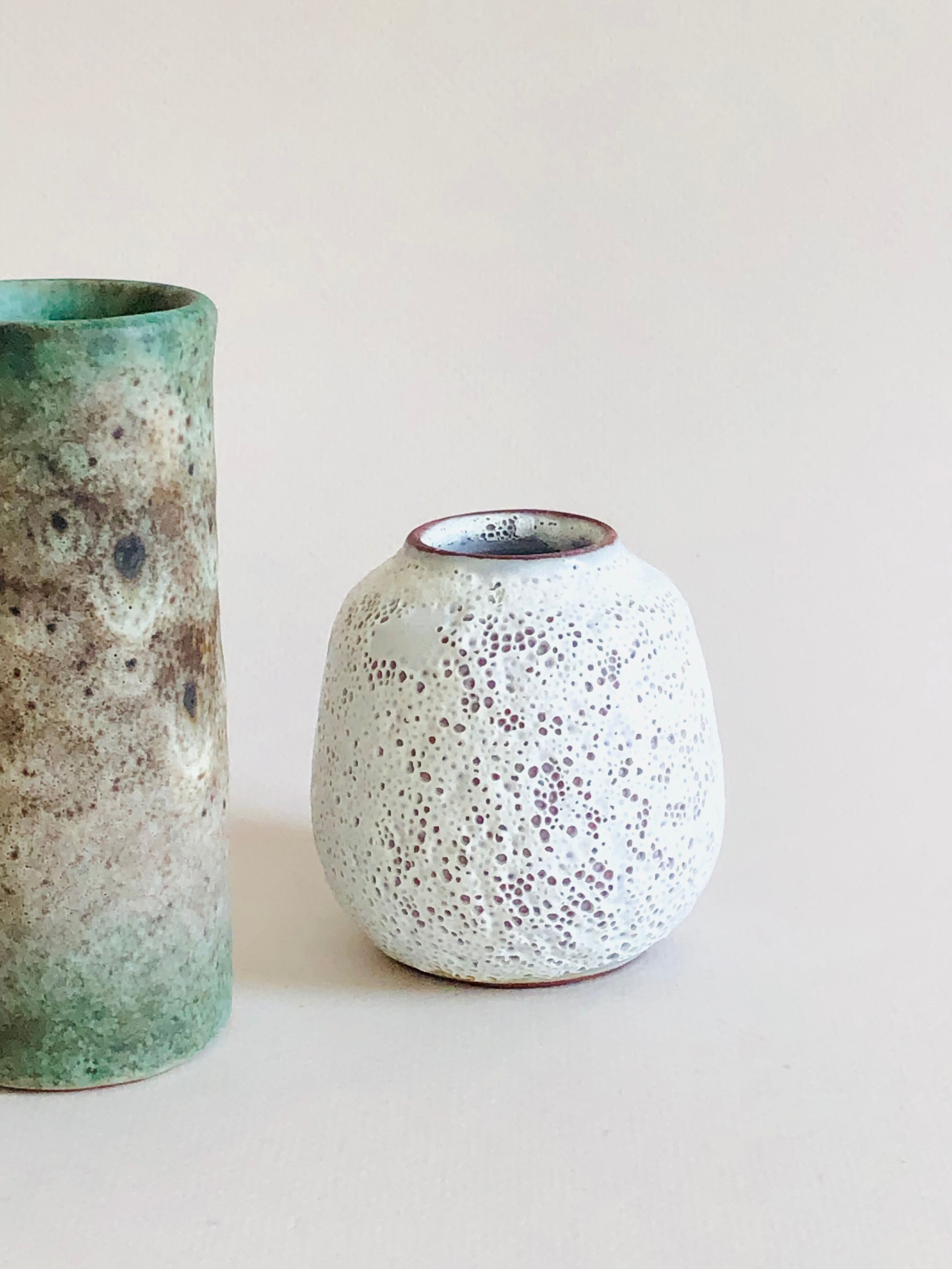 Duo of small sandstone vases