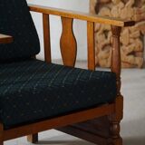 Art Nouveau, pair of oak lounge chairs, reupholstered in style fabric, 1920s.