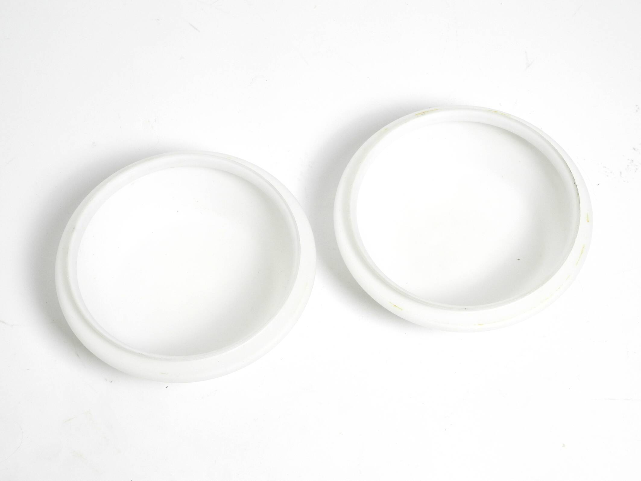 Pair of Mid Century wall or ceiling lamps made of glass with copper-plated