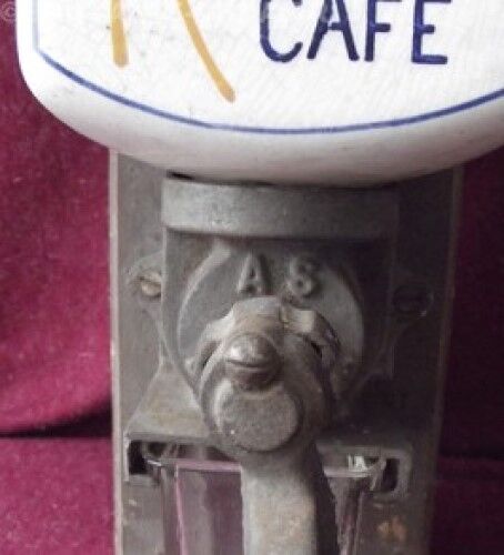 Old wall-mounted coffee grinder